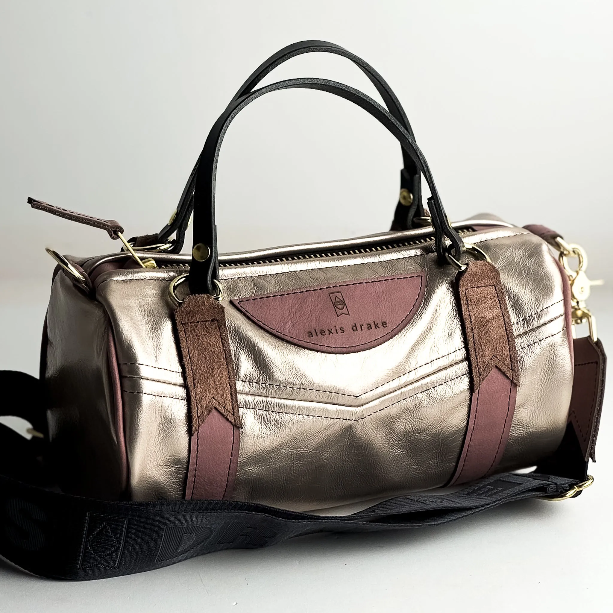 Urban Edge Collection | Gigi Baby Duffel   Crossbody | Distressed Pink Jade   Champagne Steel